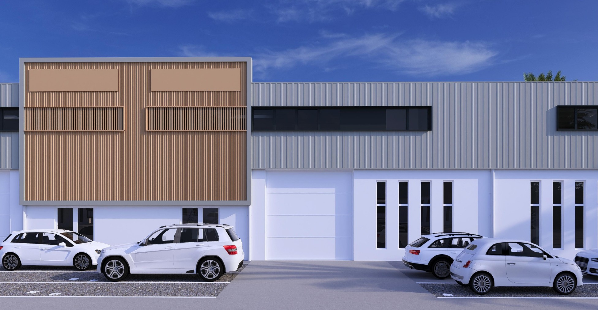 Façade d'atelier du PAE Pierrefonds avec portes de garage et bardage bois